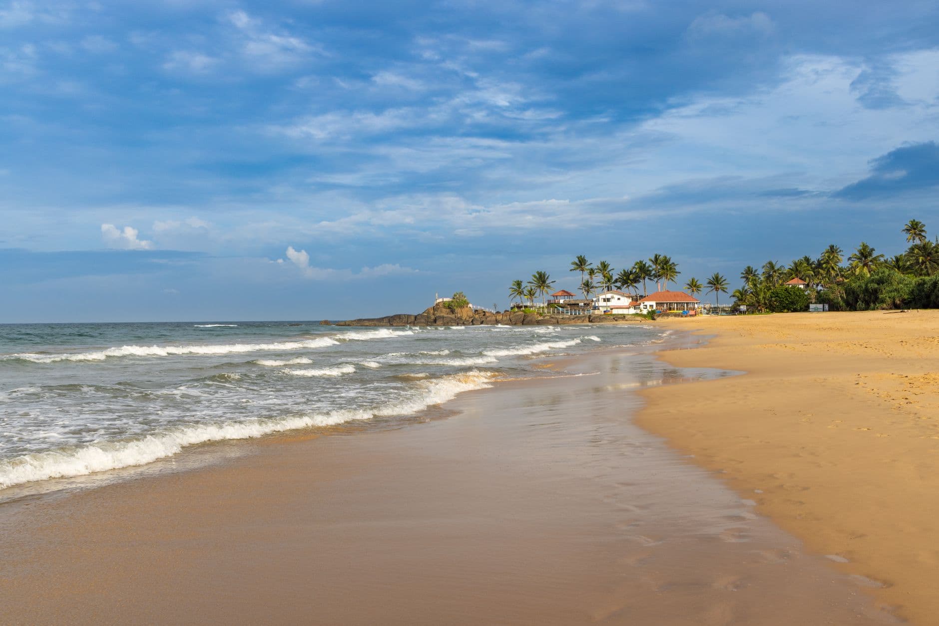 Golden sand where the Bentota river meets the sea