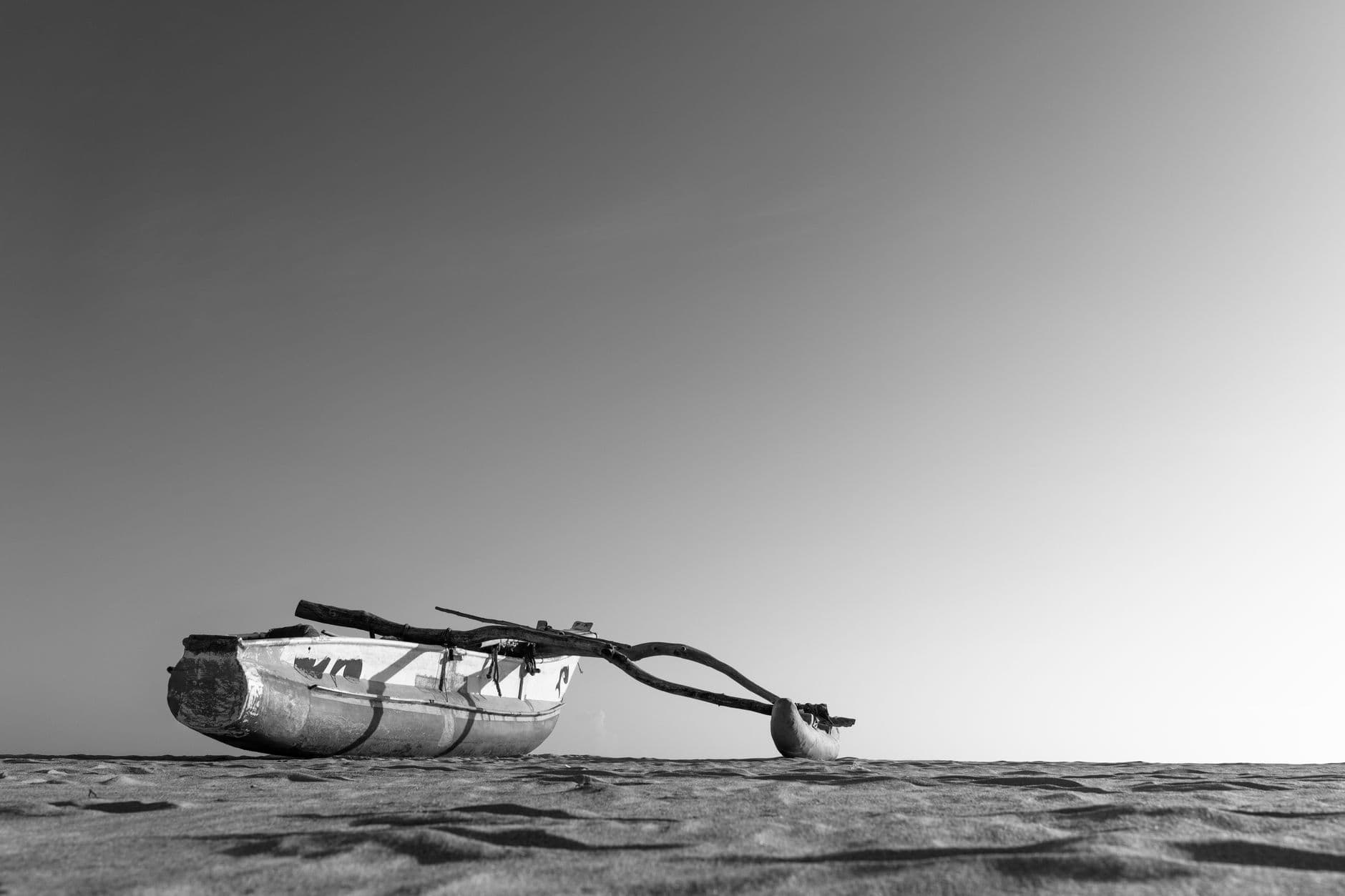 An outrigger fishing boat on the sand near Arugam Bay