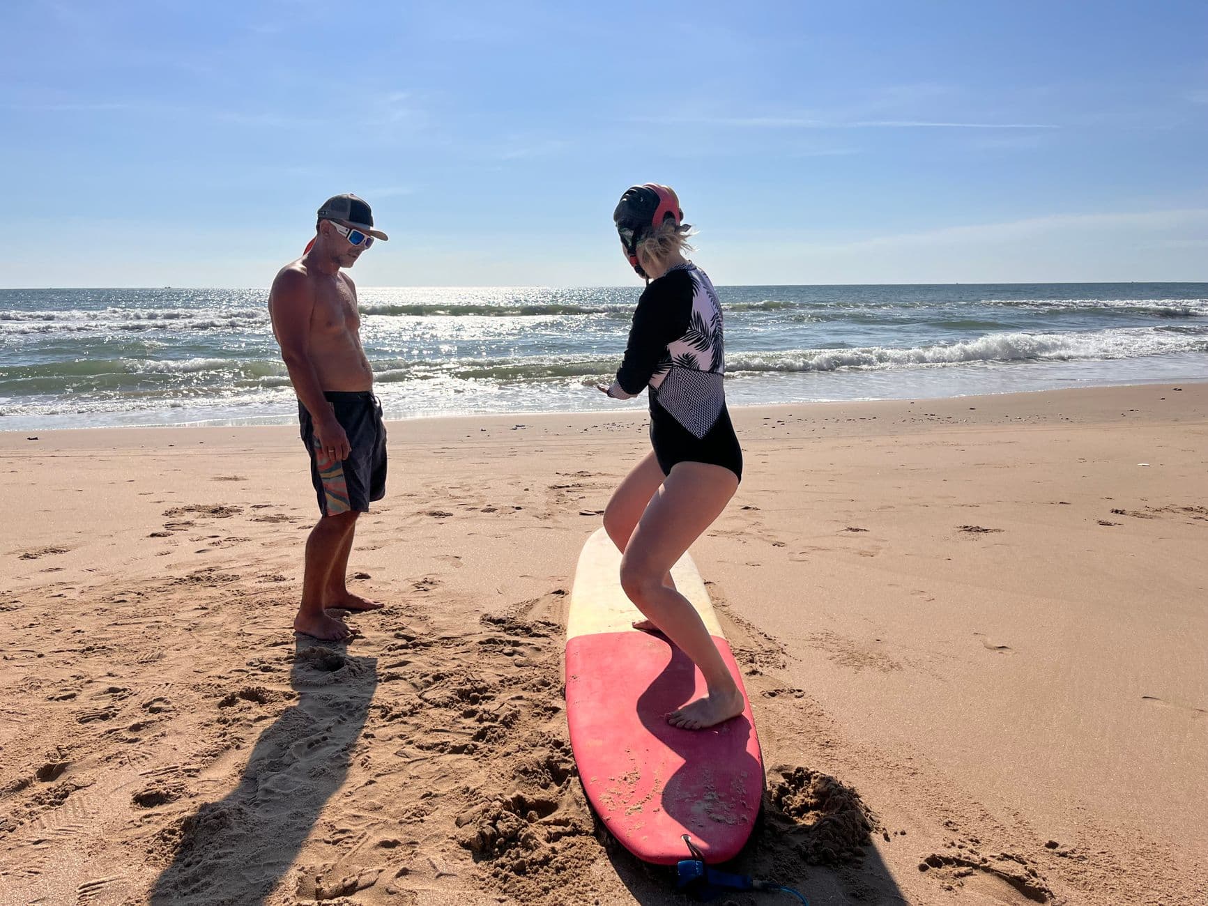 A first surf lesson on the sand at Weligama Bay